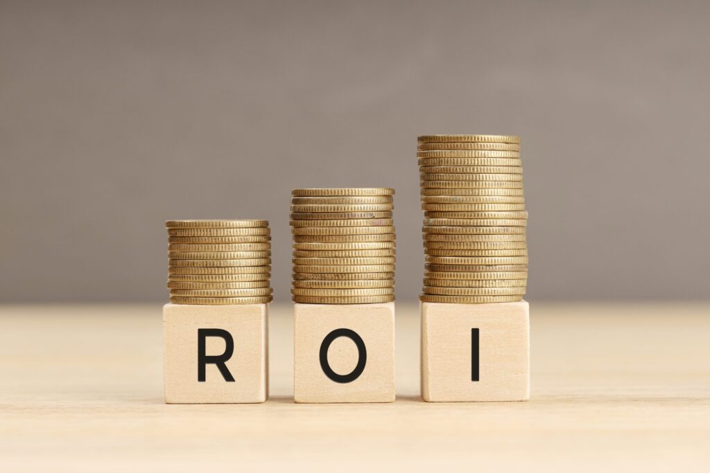 ROI word in wooden blocks with coins